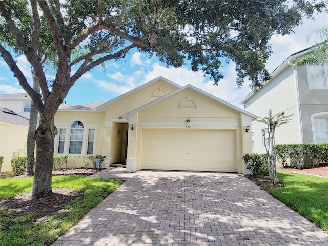 ranch-style home featuring a garage