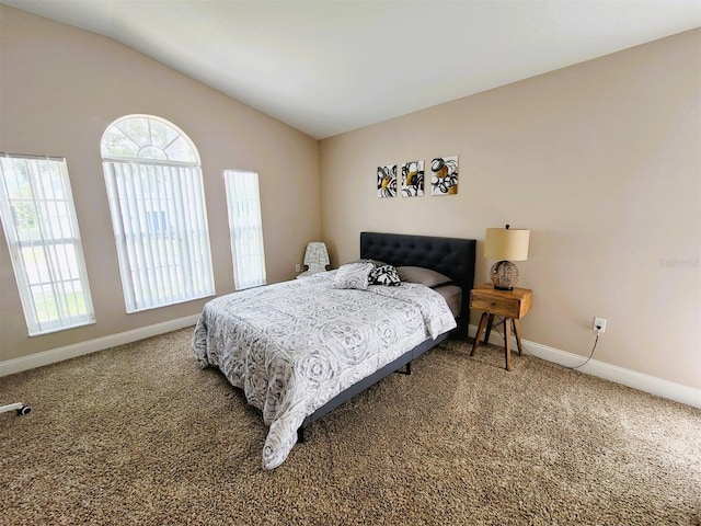 carpeted bedroom featuring vaulted ceiling