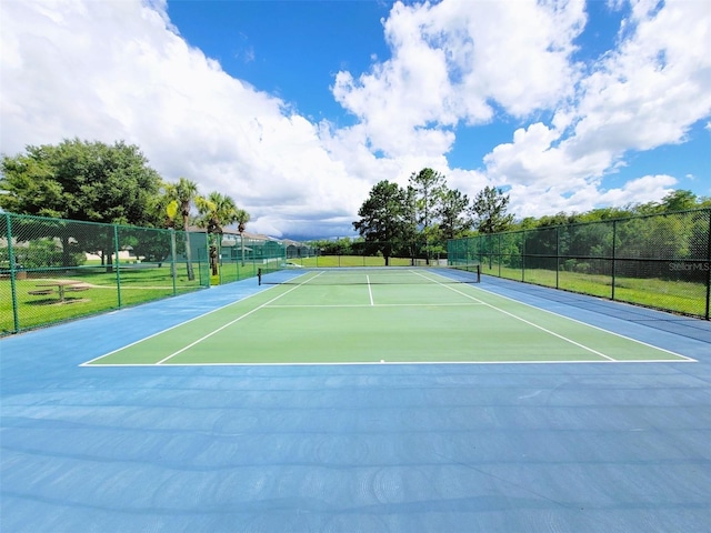 view of sport court with basketball hoop