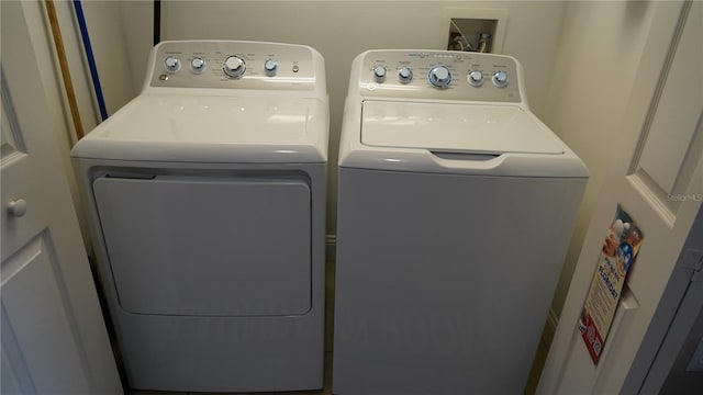 clothes washing area featuring washing machine and clothes dryer