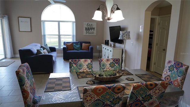 tiled living room with a chandelier