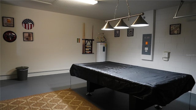 game room with concrete floors, electric water heater, a baseboard heating unit, and pool table