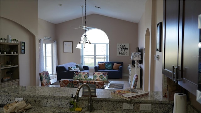 living room featuring lofted ceiling