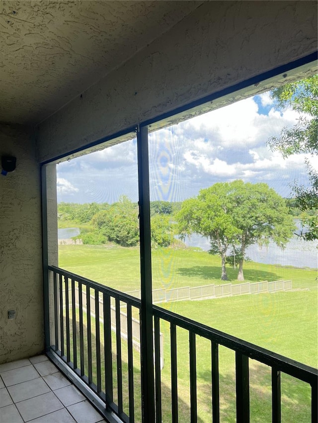 unfurnished sunroom featuring a wealth of natural light