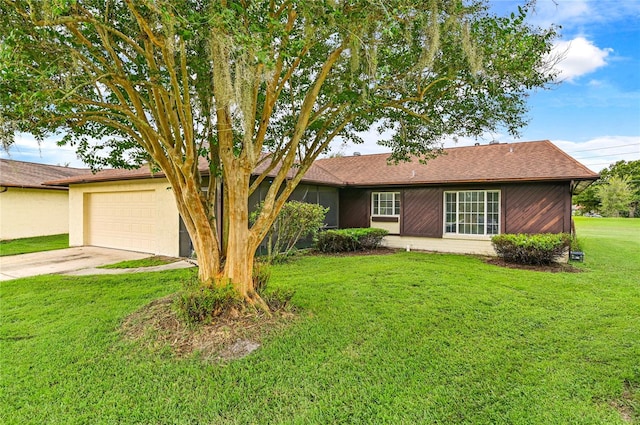 ranch-style home featuring a front yard and a garage