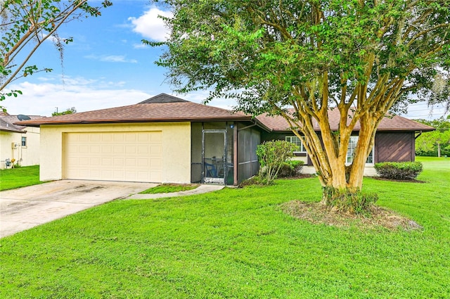 ranch-style home with a front yard and a garage