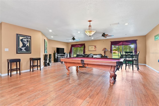 playroom with ceiling fan, billiards, a textured ceiling, and light wood-type flooring