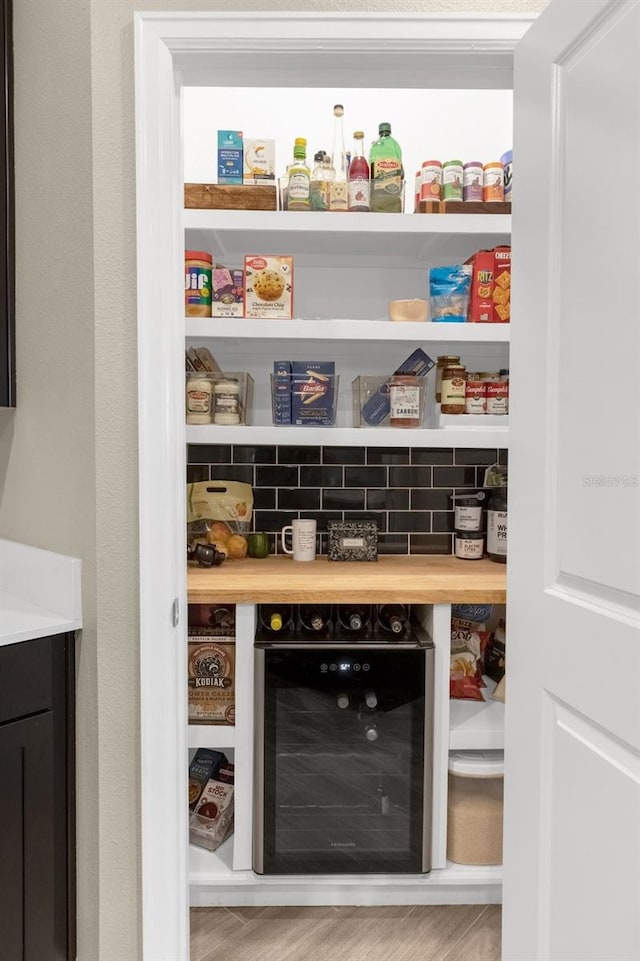 pantry featuring wine cooler