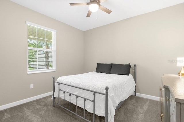 bedroom featuring dark colored carpet and ceiling fan