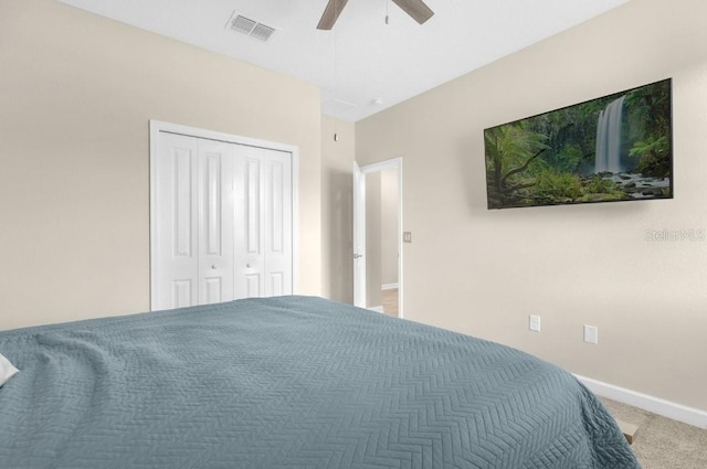 bedroom featuring carpet, a closet, and ceiling fan