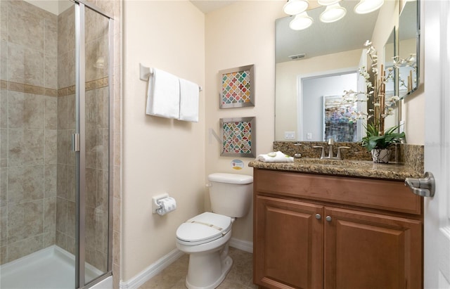 bathroom with oversized vanity, toilet, tile floors, and a shower with door