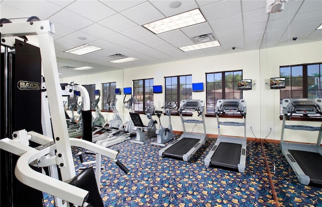 gym with carpet and a drop ceiling