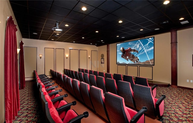 home theater featuring carpet flooring and a drop ceiling