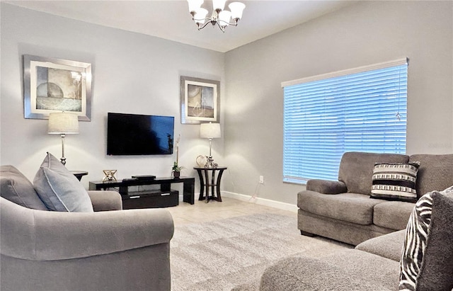 living area featuring baseboards, a chandelier, and light tile patterned floors