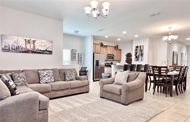 carpeted living room with a chandelier