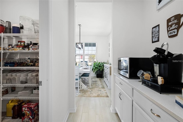 interior space featuring stainless steel microwave