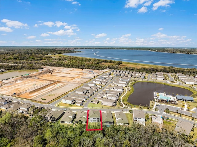 aerial view with a residential view and a water view