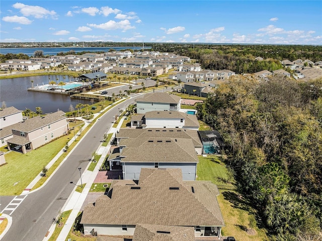 drone / aerial view with a residential view and a water view