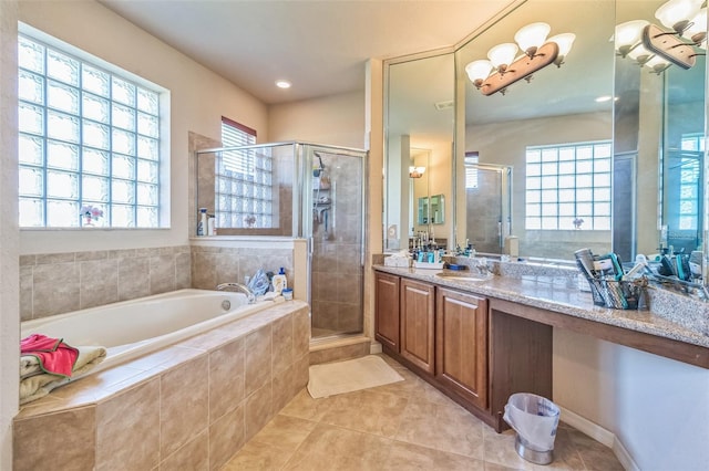 bathroom featuring vanity, separate shower and tub, and tile patterned floors