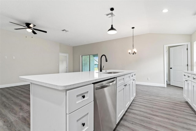 kitchen with sink, a kitchen island with sink, dishwasher, and white cabinetry