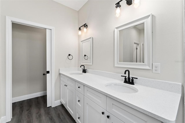 bathroom with hardwood / wood-style floors and vanity