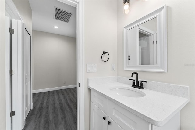 bathroom featuring wood-type flooring and vanity