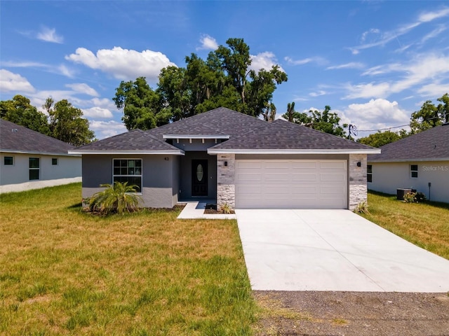 view of front of house featuring a front lawn and a garage