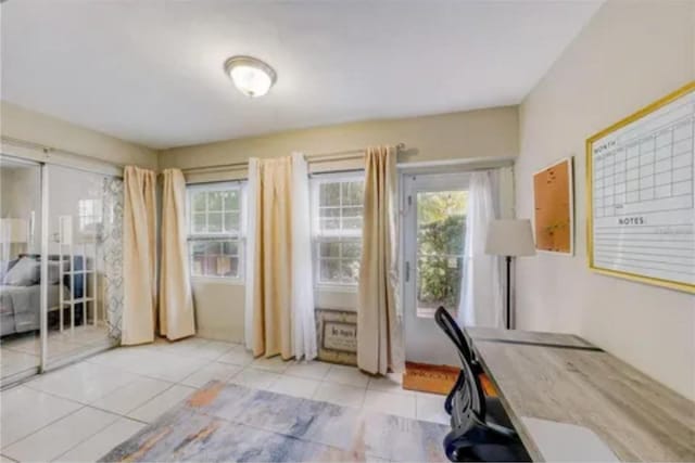 office area featuring a wealth of natural light and tile patterned flooring