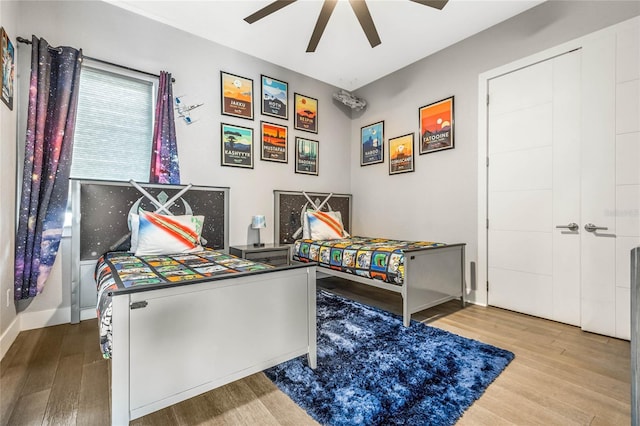 game room with ceiling fan and light hardwood / wood-style floors