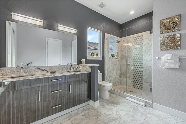 bathroom with vanity, an enclosed shower, and toilet