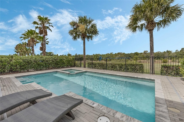 view of swimming pool featuring an in ground hot tub