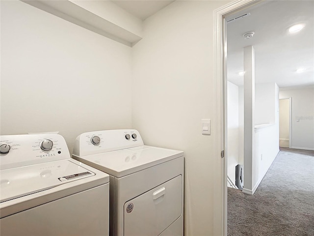 laundry area featuring dark colored carpet and independent washer and dryer