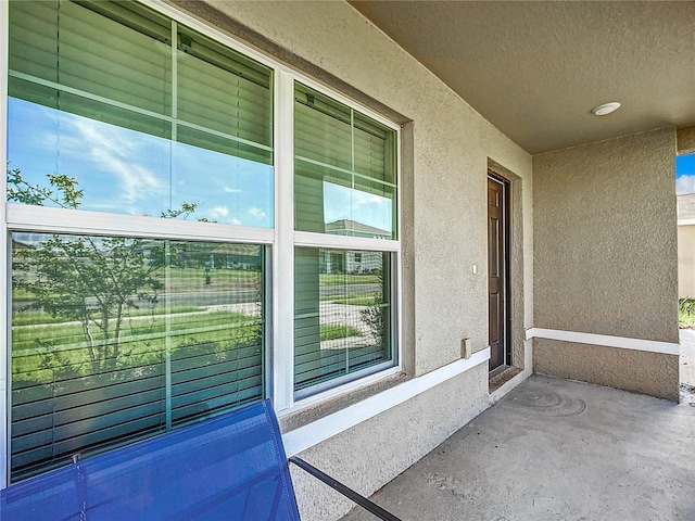 exterior space featuring stucco siding