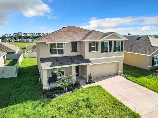 view of front of house with a garage and a front yard