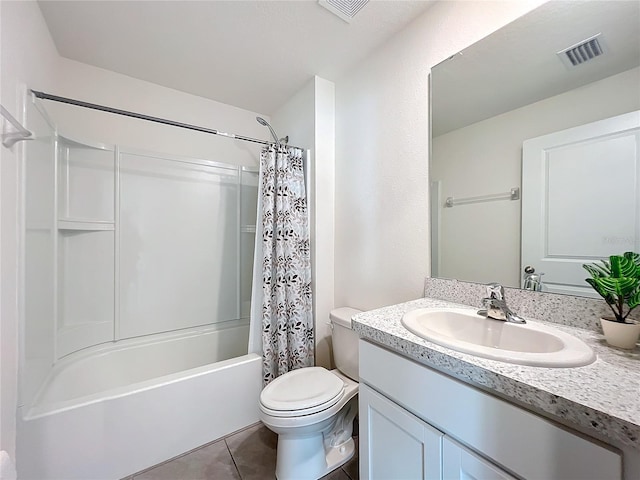 bathroom featuring visible vents, toilet, shower / bath combo with shower curtain, tile patterned floors, and vanity