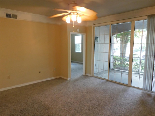 carpeted empty room featuring ceiling fan