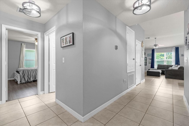 hallway with light tile patterned flooring