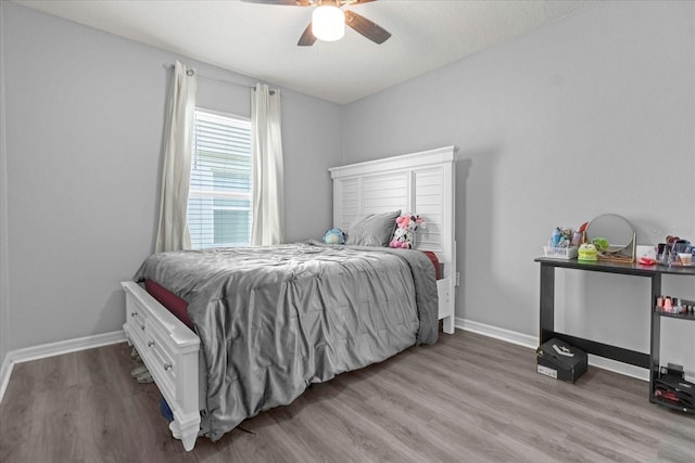 bedroom featuring light hardwood / wood-style flooring and ceiling fan