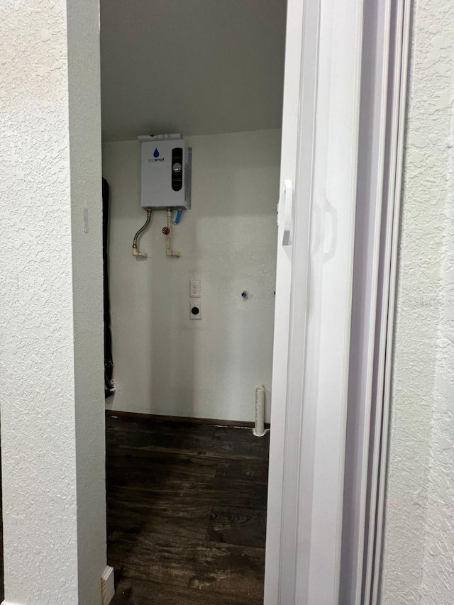 1526 Lakewood Rd, Davenport, FL 33837 - washroom featuring electric dryer hookup, wood finished floors, and a textured wall