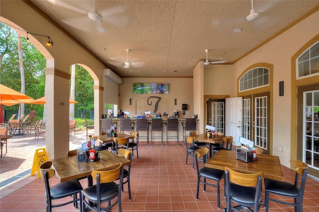 view of patio featuring a wall unit AC and ceiling fan