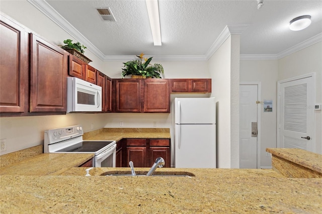 kitchen featuring white appliances, a textured ceiling, sink, and crown molding