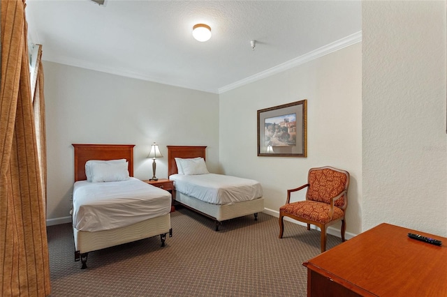 bedroom with carpet floors and crown molding