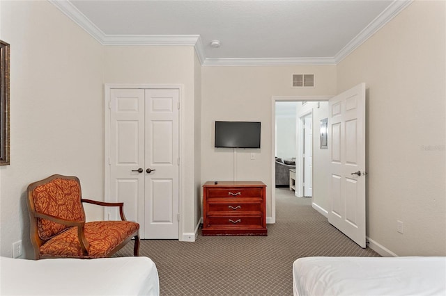 carpeted bedroom with a closet and ornamental molding