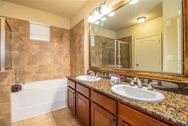 bathroom with shower with separate bathtub, double vanity, and tile patterned flooring