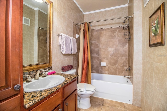 full bathroom with shower / tub combo, toilet, tile patterned flooring, tile walls, and vanity