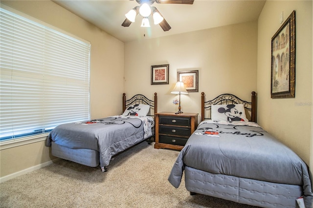 bedroom with ceiling fan and carpet