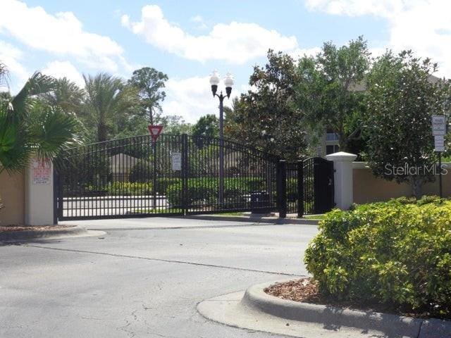 view of gate featuring fence