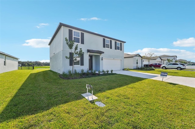 view of front of house with a front lawn and a garage