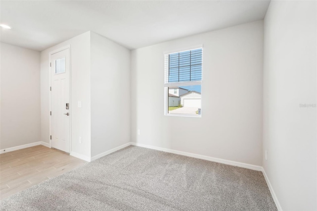 spare room with light wood-type flooring