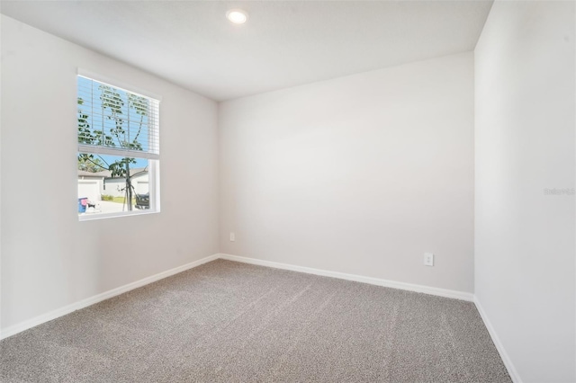 unfurnished room with carpet floors